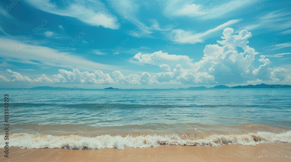 Fototapeta premium A beautiful beach with a peaceful view of the sea and sky. Tropical beach for relaxing holidays