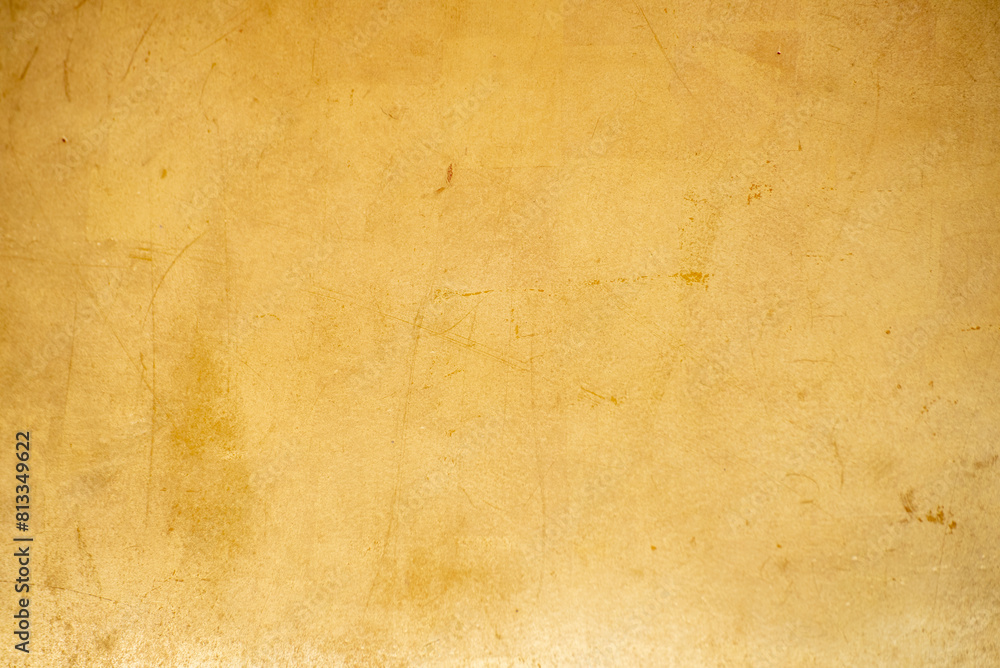 Fototapeta premium Gold texture design element blurred background glittering. Golden pattern backdrop decoration with copy space. Magic yellow orange shiny glowing selective focus. Glamour effect gold antique defocused