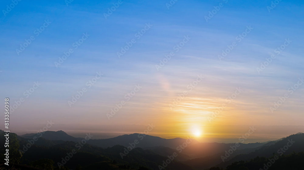 Scenic mountain landscape and bright sunrise or sunset sky over the horizon. Natural skyscape background Scenic mountain landscape and bright sunrise or sunset sky over the horizon. Natural skyscape background