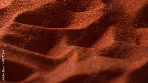 Small bright orange crystals of potassium dichromate, close up, abstract colorful background photo