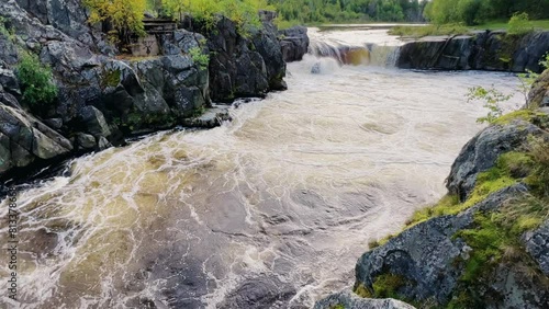 Voytsky padun waterfall in autumn. The famous powerful and wide Karelian waterfall Voytsky Padun is surrounded by rocks and greenery. Cascading waterfall on the river. Karelia, Russia 4K photo