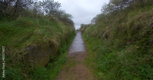 Wide shot looking up a old military concrete road going to the beach at Theddlethorpe, Dunes, National Nature Reserve at Saltfleetby photo