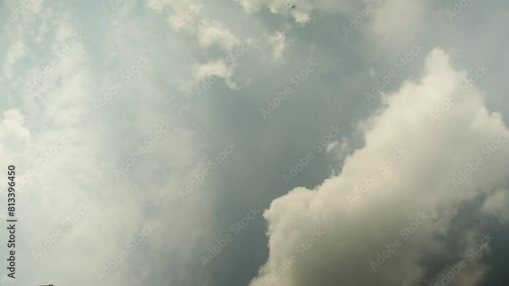 Dynamic timelapse of shifting clouds in a stormy sky, showcasing nature's moody ambiance Dynamic timelapse of shifting clouds in a stormy sky, showcasing nature's moody ambiance
