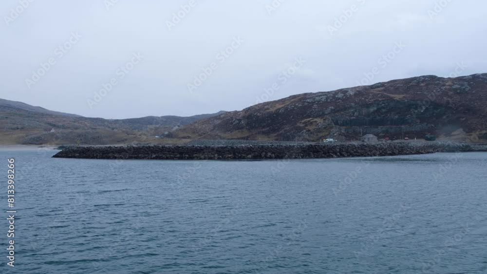 Approaching Isle of South Uist in the Outer Hebrides of Scotland on passenger ferry with landscape view of island and harbour Approaching Isle of South Uist in the Outer Hebrides of Scotland on passenger ferry with landscape view of island and harbour