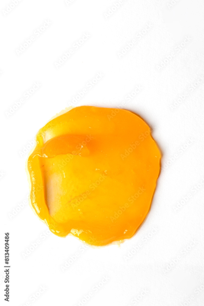 Yellow creamy texture swatch, clean cleansing butter or balsam smear on white background. Abstract cosmetic smear Yellow creamy texture swatch, clean cleansing butter or balsam smear on white background. Abstract cosmetic smear