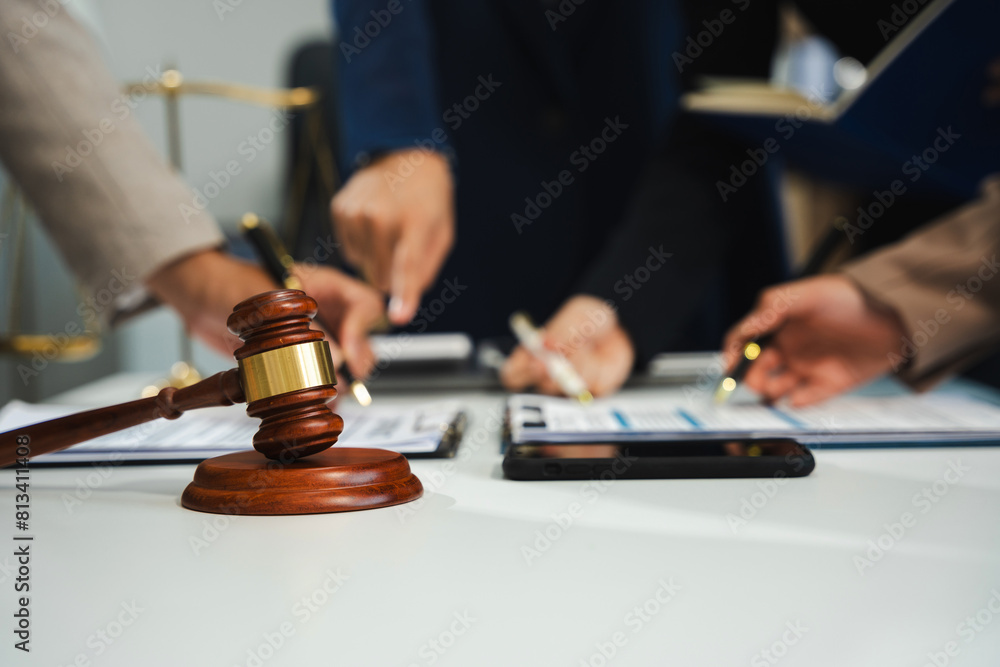 Teamwork of business lawyer meeting working hard about legal legislation in courtroom to help their customer.. Teamwork of business lawyer meeting working hard about legal legislation in courtroom to help their customer..