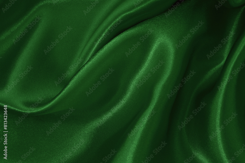 Fototapeta premium Dark green fabric cloth texture for background and design art work, beautiful crumpled pattern of silk or linen.
