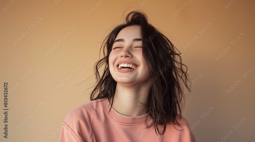 Portrait of beautiful smiling young woman with dark hair wearing pink sweatshirt standing over yellow background, looking away and laughing. Copy space for your product or text.
Portrait of beautiful smiling young woman with dark hair wearing pink sweatshirt standing over yellow background, looking away and laughing. Copy space for your product or text.
