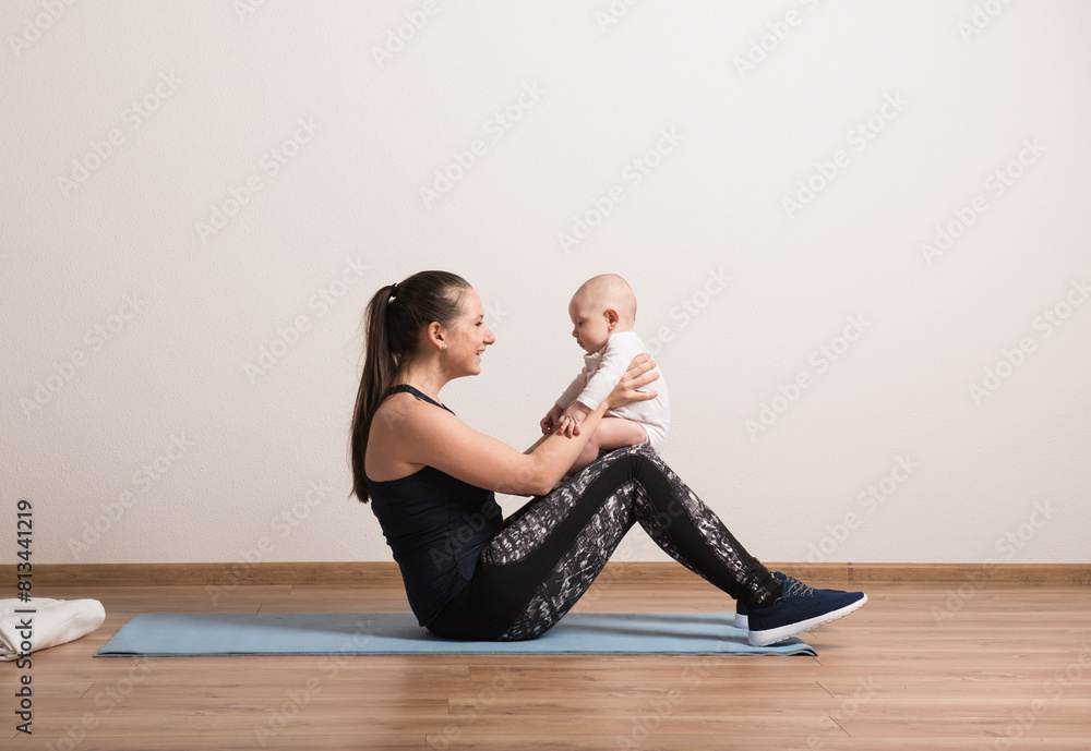 Home exercise for mother and baby, mommy and me workout. Physical activity for mother while bonding with children. Home exercise for mother and baby, mommy and me workout. Physical activity for mother while bonding with children.