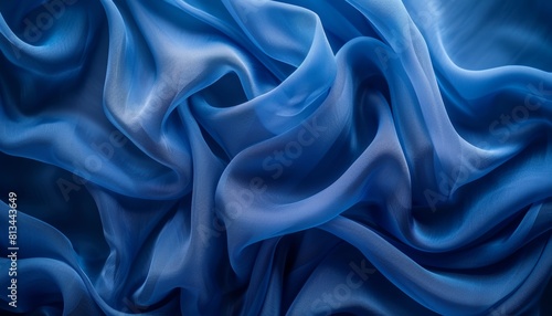 Tranquil blue silk waves flowing fabric in serene abstract background with copy space