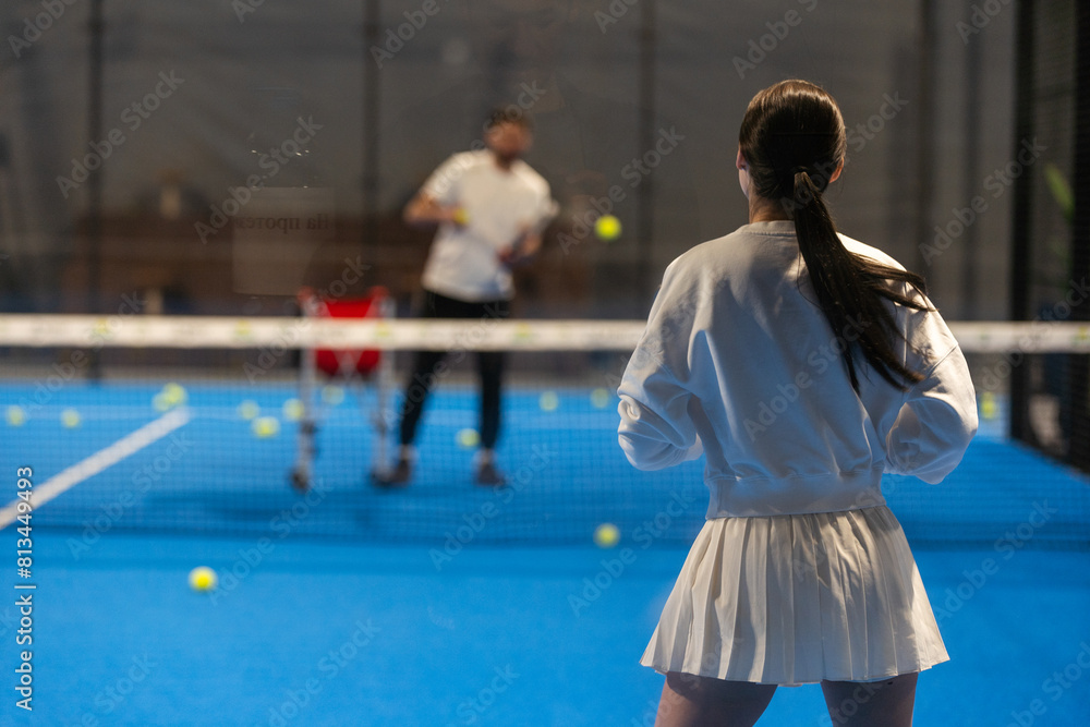 Young Girls Is Playing Padel on an Court. Young Girls Is Playing Padel on an Court.