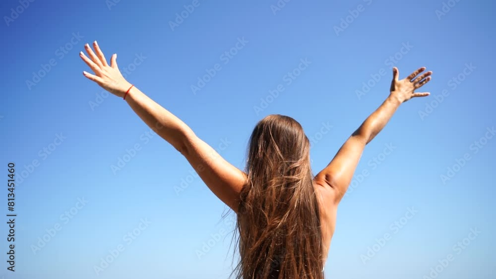 Woman traveller arms raised. Happy relaxed woman breathing fresh air raising arms over blue sky at summer, Dreaming, freedom and traveling concept. Woman traveller arms raised. Happy relaxed woman breathing fresh air raising arms over blue sky at summer, Dreaming, freedom and traveling concept.