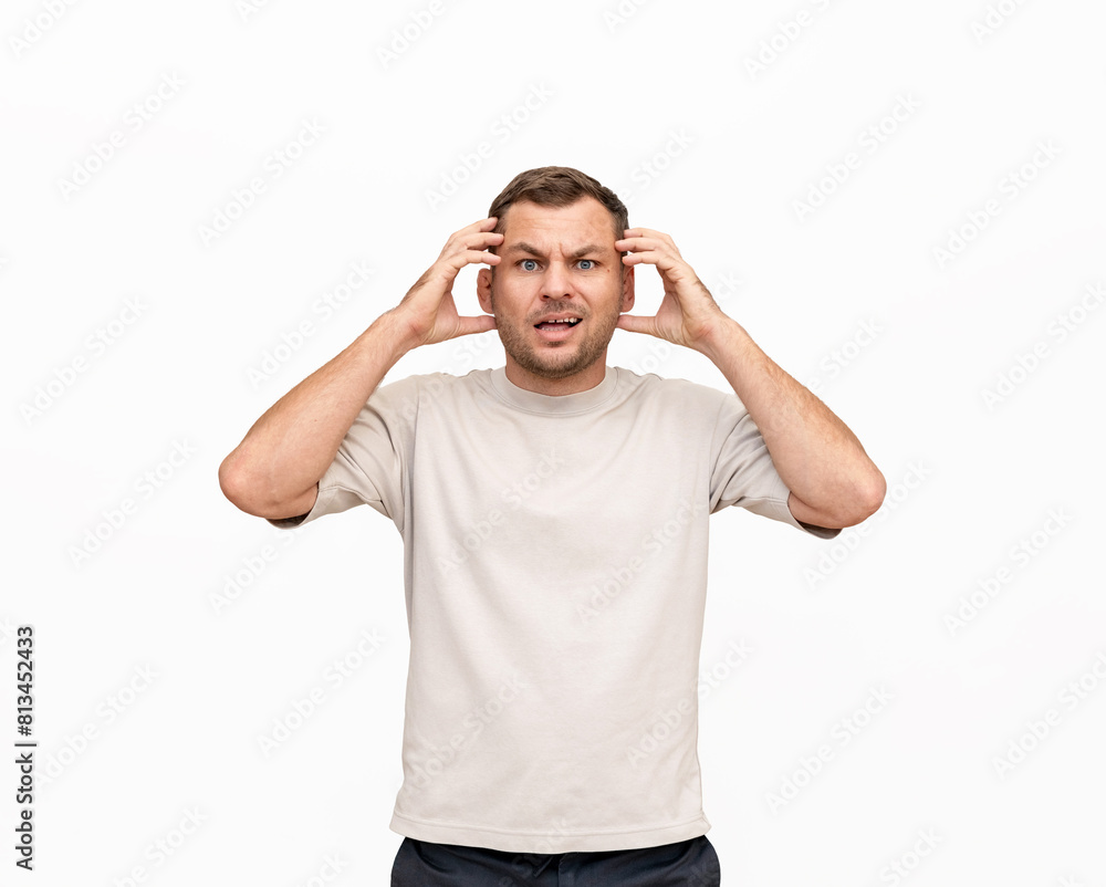 Nonplussed adult man expressing emotions of confusion on white background in studio. Nonplussed adult man expressing emotions of confusion on white background in studio.