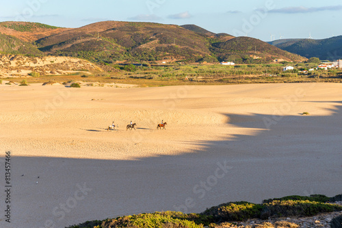 horseback riding on the beach in Praia da Bordeira, Algarve, Portugal
