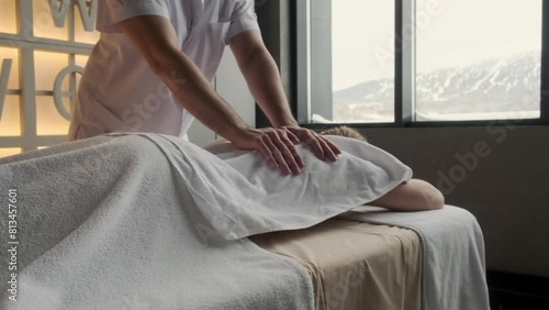 Relaxation woman back massage with masseur in cosmetology spa centre. Relaxing female customer get service aromatherapy massage with masseuse in spa salon. photo