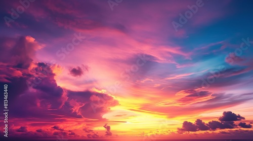 A tropical sunset, where the sky transitions from warm oranges and pinks near the horizon to deep purples and blues overhead, creating a breathtaking display of color gradients.