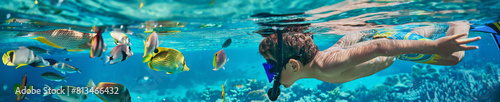 Child Snorkeling in Tropical Waters Surrounded by Colorful Fish