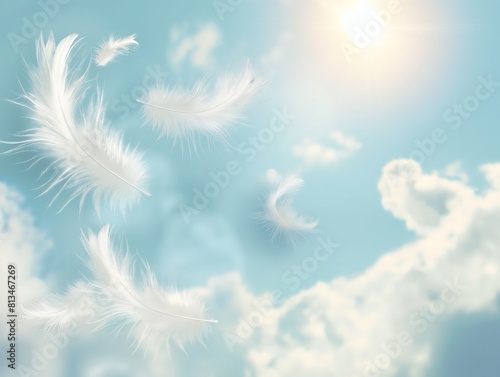 White feathers floating gently against a soft blue sky with fluffy clouds and radiant sunlight.