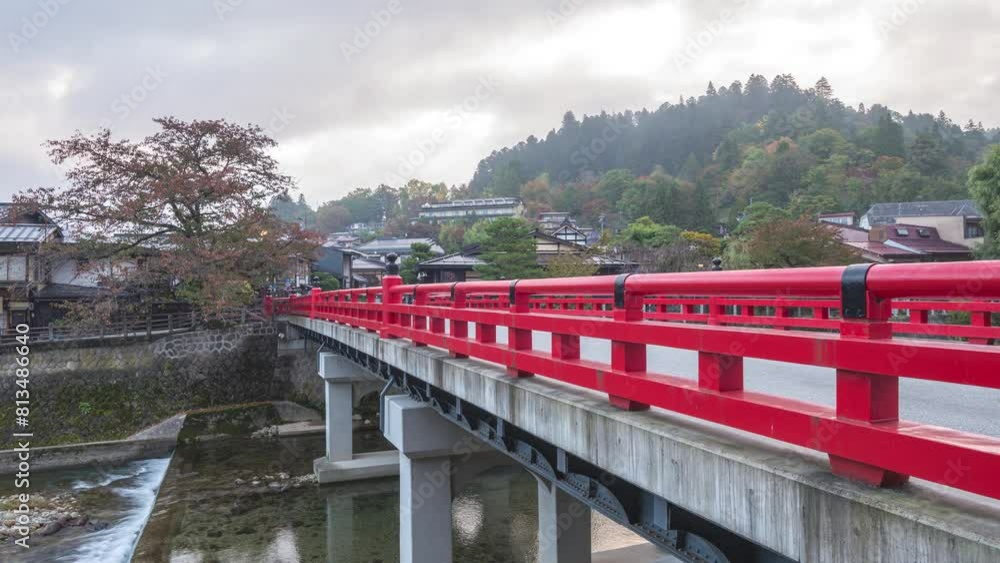 Takayama Gifu Japan time lapse at Nakabashi red bridge and Miyagawa river in autumn season Takayama Gifu Japan time lapse at Nakabashi red bridge and Miyagawa river in autumn season
