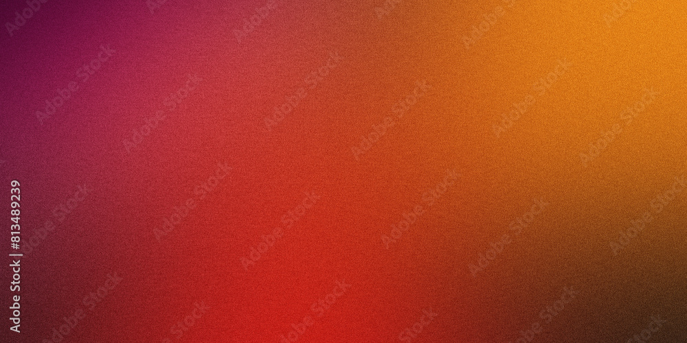 Abstract grainy texture transitioning from orange to red hues Abstract grainy texture transitioning from orange to red hues