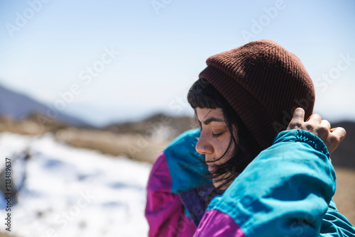Young woman wearing knit hat in winter photo