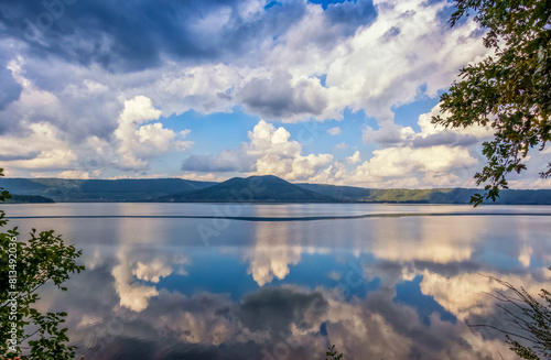 Reflection of clouds seen in Lake Vico, Viterbo province, Lazio, Italy photo