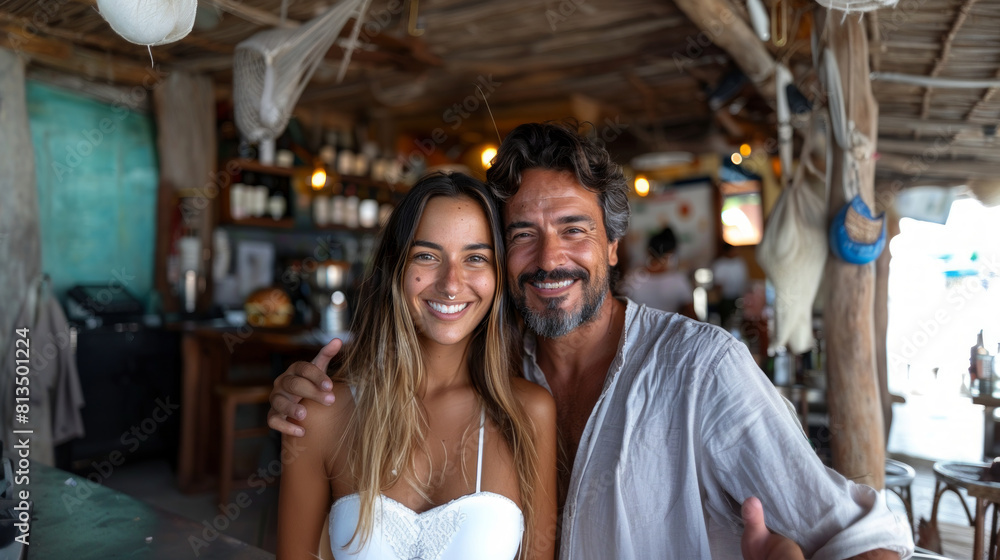 Happy Couple Enjoying Time Together at a Beach Bar, Taking a Selfie Happy Couple Enjoying Time Together at a Beach Bar, Taking a Selfie