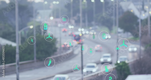 Digital icons overlay busy city traffic, symbolizing smart transportation