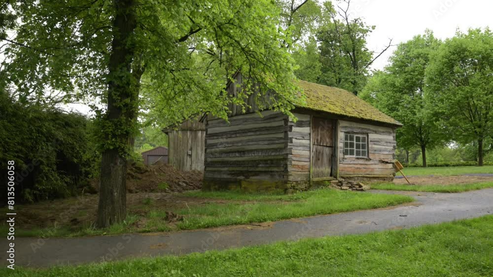 A small colonial home inside around trees. A small colonial home inside around trees.