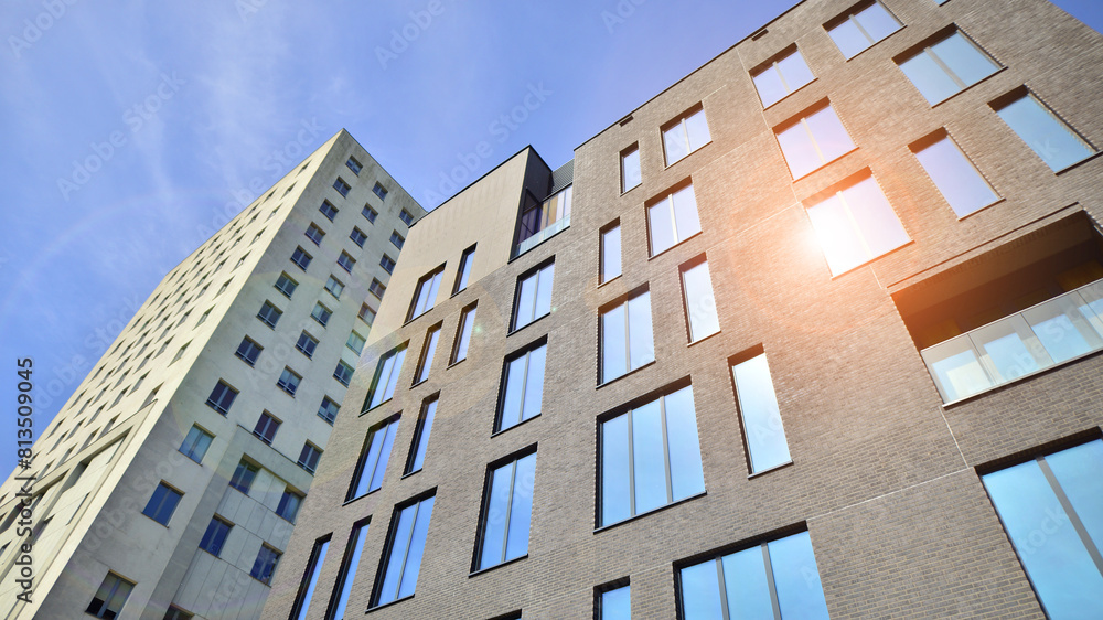 Modern office building detail. Perspective view of geometric angular concrete windows on the facade of a modernist brutalist style building. Modern office building detail. Perspective view of geometric angular concrete windows on the facade of a modernist brutalist style building.