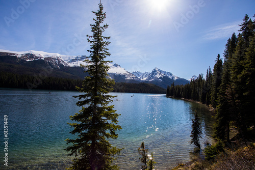 Summer landscape and people kayaking and fishing in Maligne lake, Jasper National Park, Canada