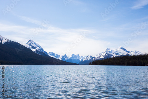 Summer landscape and people kayaking and fishing in Maligne lake, Jasper National Park, Canada