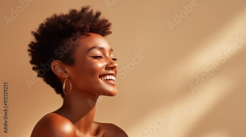 Beautiful, sexy, happy smiling dark-skinned African American woman with perfect skin and short haircut, on a creamy beige background, banner.