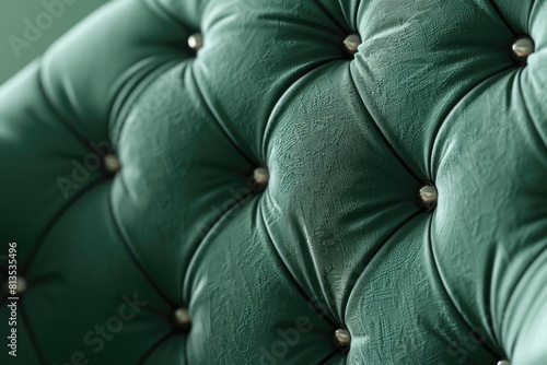 Detailed view of a green couch with buttons, ideal for furniture design projects photo