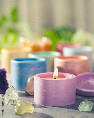 Candles in plaster candlesticks, colors of the 7 chakras, alternative medicine. Energy healing. Aromatherapy. Alternative medicine.