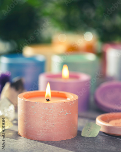 Candles in plaster candlesticks, colors of the 7 chakras, alternative medicine. Energy healing. Aromatherapy. Alternative medicine. Selective focus