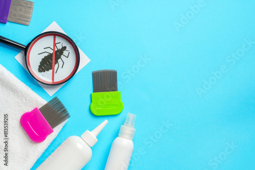 Anti lice equipment on blue background top view photo
