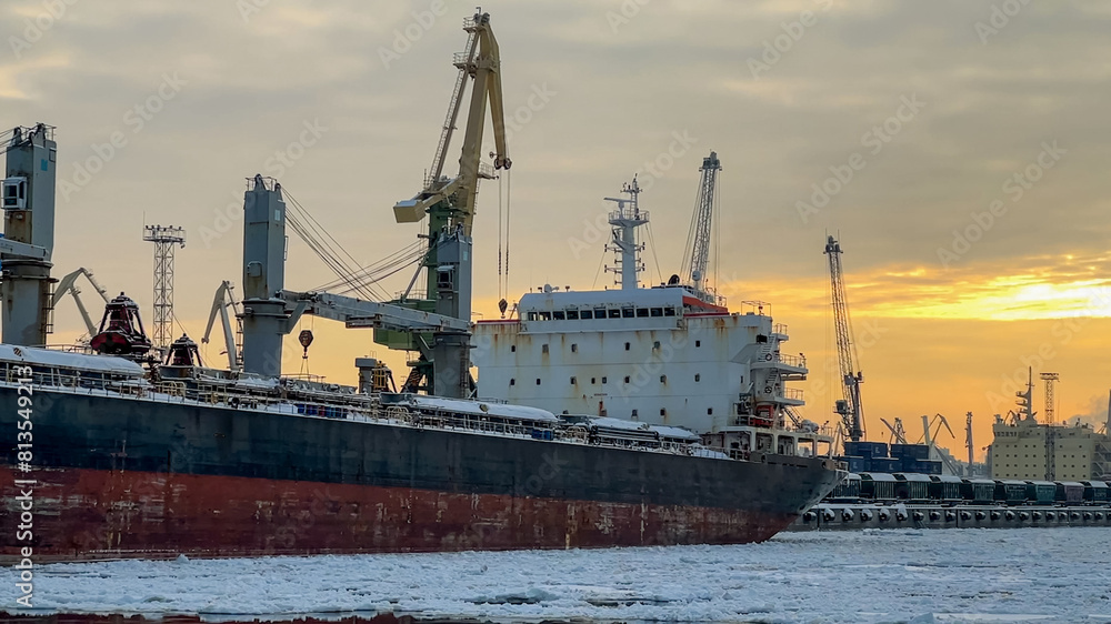 Sea port in winter with ice at the sunset time Sea port in winter with ice at the sunset time