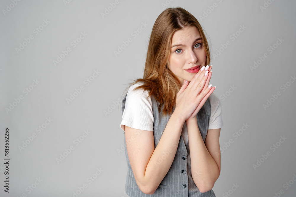 Joyful Young Blonde Woman Smiling against gray background Joyful Young Blonde Woman Smiling against gray background