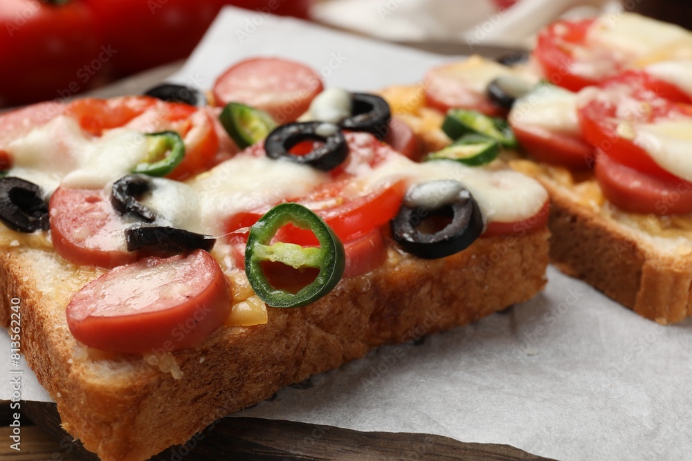 Tasty pizza toast on table, closeup view Tasty pizza toast on table, closeup view