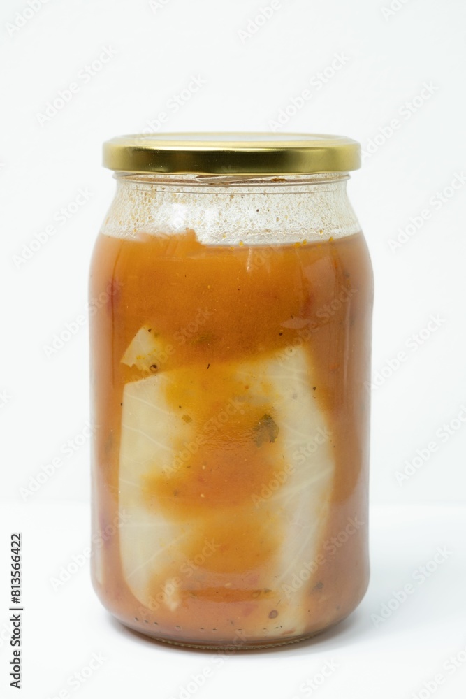 Glass jar of stuffed cabbage tomato sauce isolated on a white background Glass jar of stuffed cabbage tomato sauce isolated on a white background