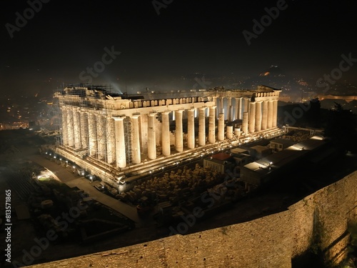 Aerial shot of the Parthenon temple at night in Athens, Greece.