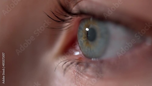 Close-up macro eye open human iris. blinking eye. beautiful blue eyes. healthy eyesight. awareness