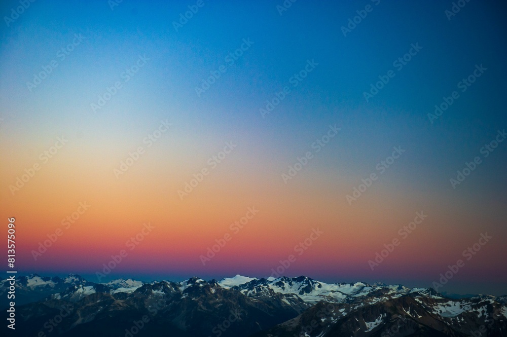 Fototapeta premium Aerial view of a bright sunset sky over Train Glacier, Pemberton, British Columbia, Canada