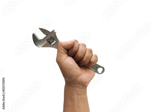 A man's hand is holding a mechanic's tool called an adjustable wrench for use in mechanic work.  or industry in factories, is a device for tightening nut heads  Isolated on a white background. photo