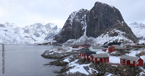 Small fishing village on the snowy Norwegian island, mountain Sakrisoy photo
