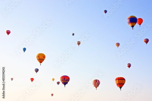 Low-angle of many hot air balloons in clear sky during Albuquerque International Balloon Fiesta