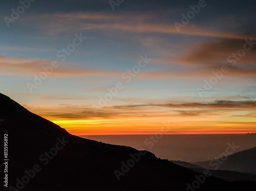 Wallpaper Mural Beautiful orange sunset over the silhouette of a hillside Torontodigital.ca