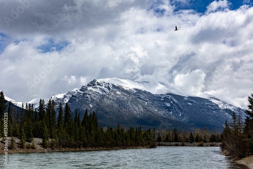 Canmore river view in the Canadian Rockies snow-capped mountains background
