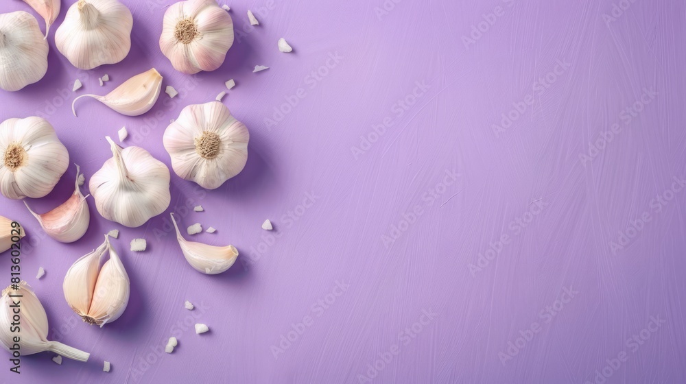 A cluster of fresh garlic bulbs surrounded by some garlic cloves A cluster of fresh garlic bulbs surrounded by some garlic cloves